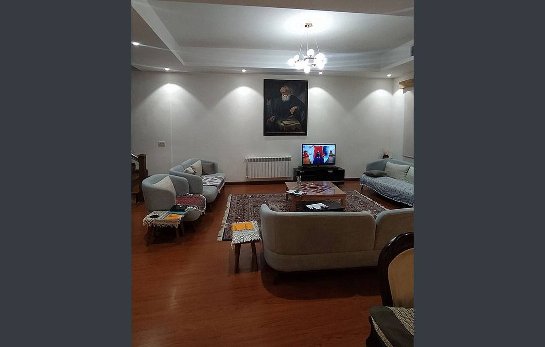 Neoclassical living room with custom TV wall and ceiling design